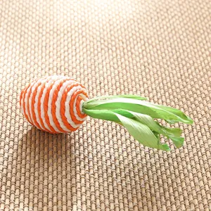 Handmade woven carrot ornament detail view, rustic straw handicraft for home decor.