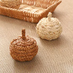 Handmade natural straw woven pumpkin ornament details, rustic autumn harvest home decor set.