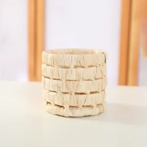 Handmade straw woven flower pot cover, natural cattail plant storage basket for home decor.