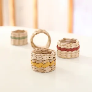 Handcrafted natural woven napkin ring detail, rustic table decor accessory. Closeup.