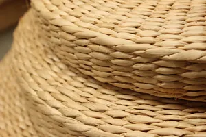 Natural straw woven futon cushion detail showing exquisite handmade texture and thick design.