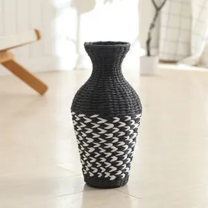 Handmade woven straw vase black and white boho home decor desktop plant flower arrangement.