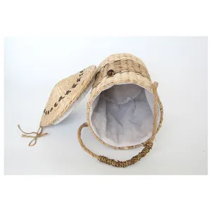 Cesta de almacenamiento de paja tejida a mano con tapa y asa de cuerda, forma de cubo.