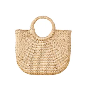Handmade woven straw bag with round handle, natural summer beach tote and shopping basket.