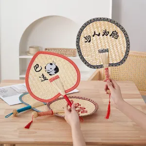 Hand-woven straw fan Chinese style summer hand-held cattail leaf fan with colorful edging.