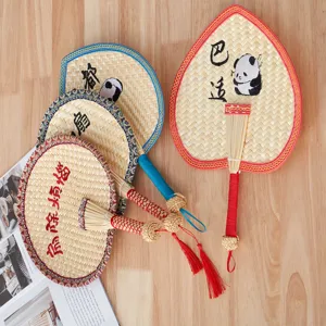 Handmade woven straw fan with Chinese style panda pattern and colorful edge for summer cooling.