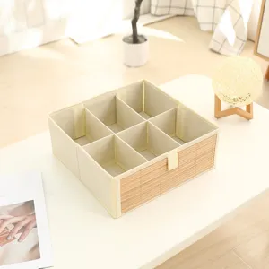 Foldable fabric clothing storage box with multiple compartments and a clean bamboo front panel.