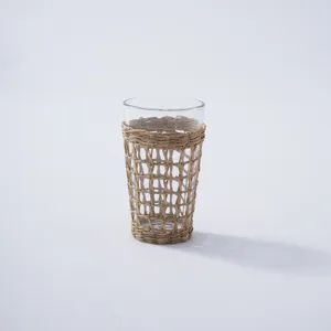 Woven rattan glass cup detail shot, perfect for hotel water, beverages, and office use.