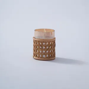 Handmade rattan woven glass vase detail view, vintage woven dried flower pot decor.