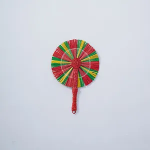 Detailed view of handmade woven straw fan texture and colorful handle craftsmanship.