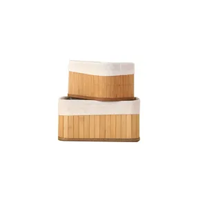 Natural bamboo woven storage basket set with white fabric lining for home organization.