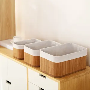 Woven bamboo storage basket set with fabric liner for home organization, desktop tidy and decor.