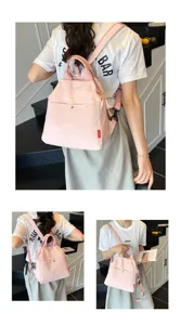 Detail view of the stylish candy pink commuter backpack showing high quality texture and design.