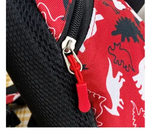 Toddler anti-lost backpack detail view, red dinosaur print fabric with black mesh panel.