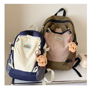 Koreanischer Stil Kontrast Farbe Kinder Rucksack mit süßem Plüsch Anhänger Schule.