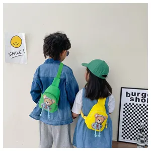 Detail view of kids chest bag featuring cute hoodie bear design, adjustable strap and back view.