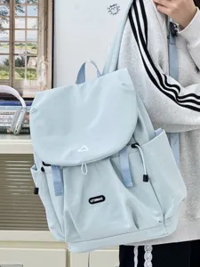 Light blue Japanese casual backpack with drawstring and flap closure for daily commute and travel.