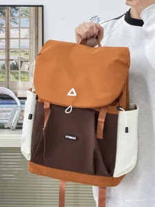 Detailed close-up view of the casual color-blocked canvas backpack with multiple pockets.