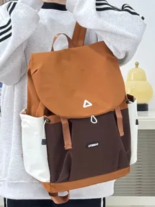 Casual colorblock backpack detail view, featuring durable fabric, multiple pockets and front flap.