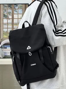 Black canvas casual backpack with drawstring and flap design for daily commuter use.