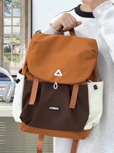 Closeup detail of the casual colorblock backpack with front pocket and contrast drawstrings.