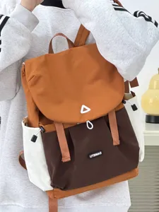 Detail view of the casual color-block backpack, showcasing durable fabric and handy front pockets.