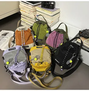 Outdoor lightweight casual crossbody bag with drawstring closure and cute tennis racket pendant.