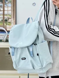 Light blue casual backpack for women, Japanese style school bookbag for daily travel and commute.