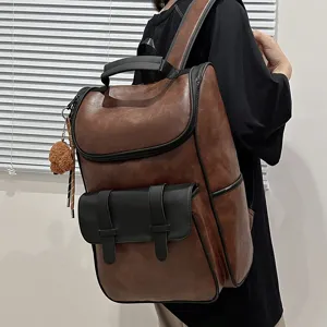Brown leather backpack for men, large capacity casual student schoolbag and computer bag.