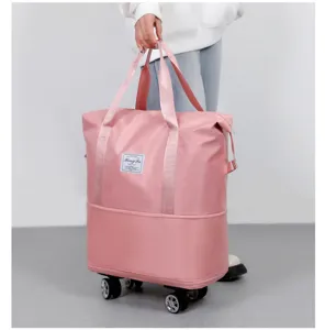 Large capacity pink travel duffel bag with universal wheels and double handles for storage.