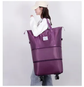 Large capacity expandable travel bag with wheels, waterproof rolling duffel for trips.