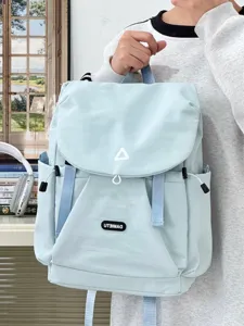 Light blue casual backpack detail, stylish student commuter bookbag with pocket and straps.