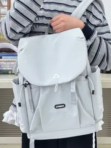 Lightweight grey Japanese casual backpack for women, student school bag, travel daypack.