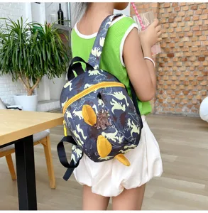 Toddler dinosaur backpack detail view, cute anti-lost school bag with 3D fins for kids 1-3 yrs