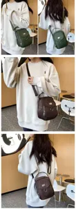 Vue détaillée du sac à bandoulière pour femme en tissu Oxford avec poches zippées.