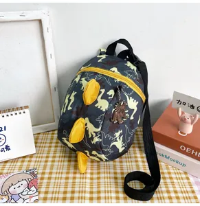 Detailed view of the cute dinosaur toddler backpack with yellow spikes and anti-lost leash.
