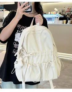 Niche design pleated backpack lightweight bow schoolbag for women casual travel daily use chic.