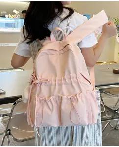 Pink casual cute bow student backpack with multi-pockets, stylish daily travel school bag.