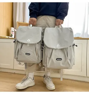 Casual grey travel backpack detail, large capacity outdoor daypack for students.