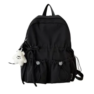 Black pleated backpack with bow and pockets, casual lightweight school bag for women.