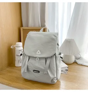 Casual light grey backpack for women, large capacity travel and school book bag.