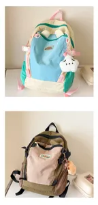 Kinder Farbblock Rucksack Detail zeigt lebendige Dopaminfarben und süßen Plüschanhänger.