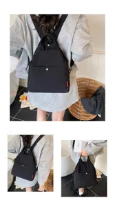 Minimalist black multifunctional backpack with top handle and front pocket detail view.