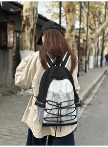 Backpack detail view showing the contrast design and drawstring pocket for outdoor travel.