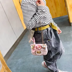 Cute kids tweed crossbody bag with flower and bunny decor, stylish single shoulder chain bag for girls.