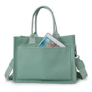 Green canvas tote bag for women, shoulder crossbody work commuter bag with front pocket.