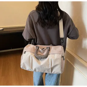 Large capacity travel duffel bag for women, stylish lightweight fitness gym tote and shoulder bag.