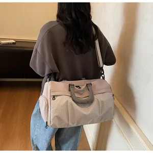 Large capacity travel duffel bag for women, lightweight sports fitness shoulder bag.