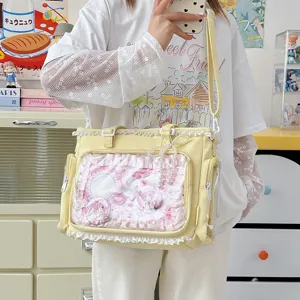 Bolso shopper transparente estilo japonés gran capacidad con volantes y bonitos pines de anime.