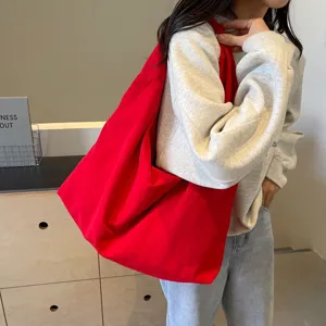 Red canvas tote bag for women, large capacity minimalist casual shoulder bag for daily commute.